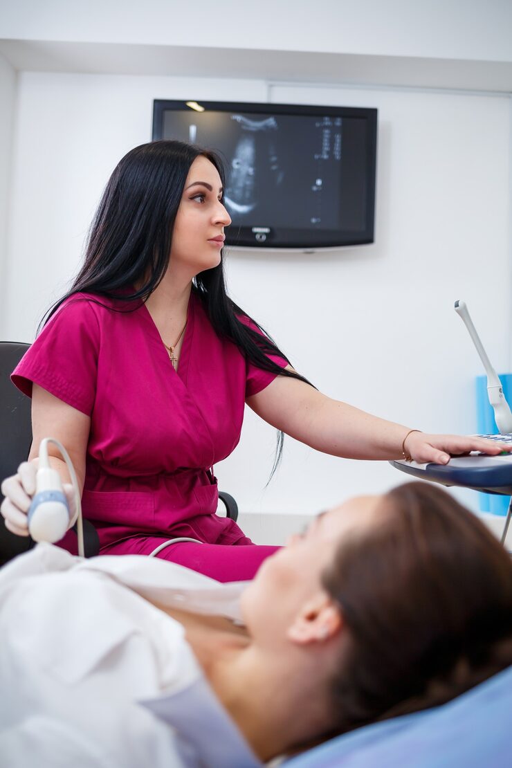 young woman lies couch doctora s appointment ultrasound scan abdominal organs is performed girl doctor examines patient_173815 17930